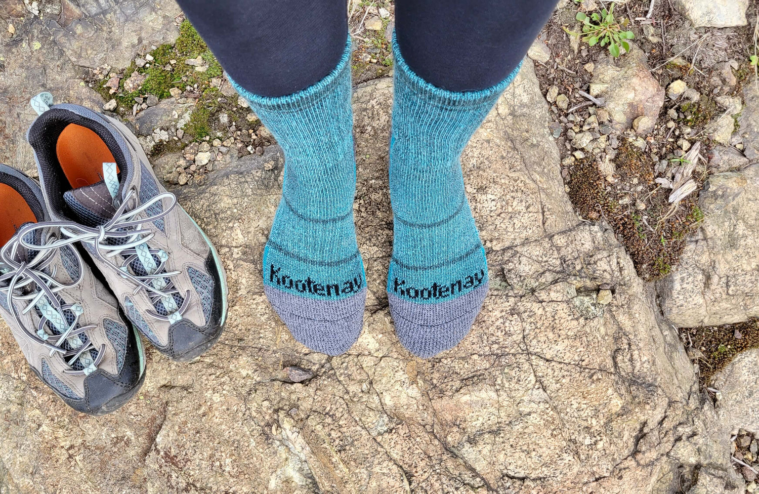 Aqua Crew Midweight Merino Wool Kootenay Socks standing on rocks